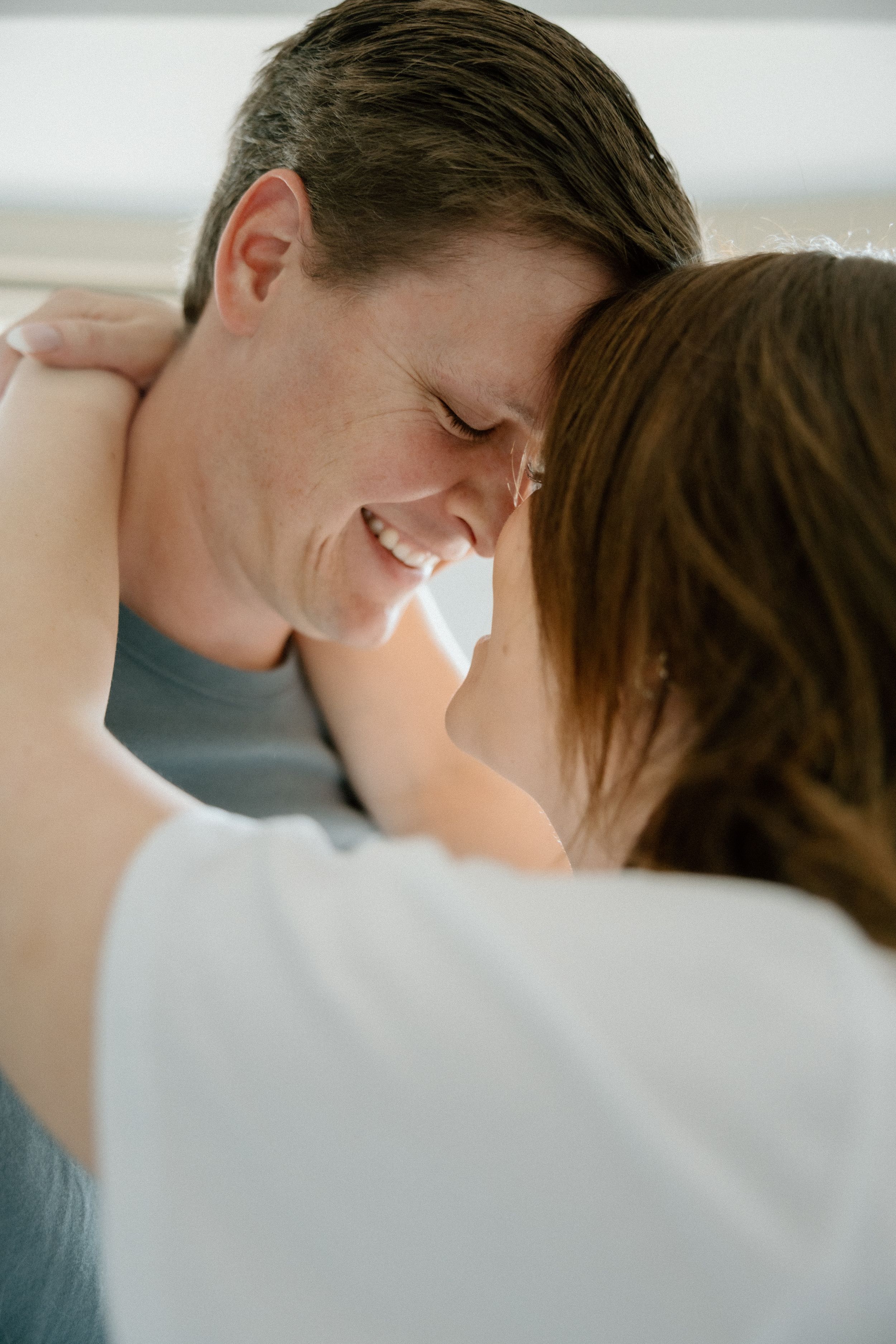 An intimate close-up of a couple sharing a tender moment together.