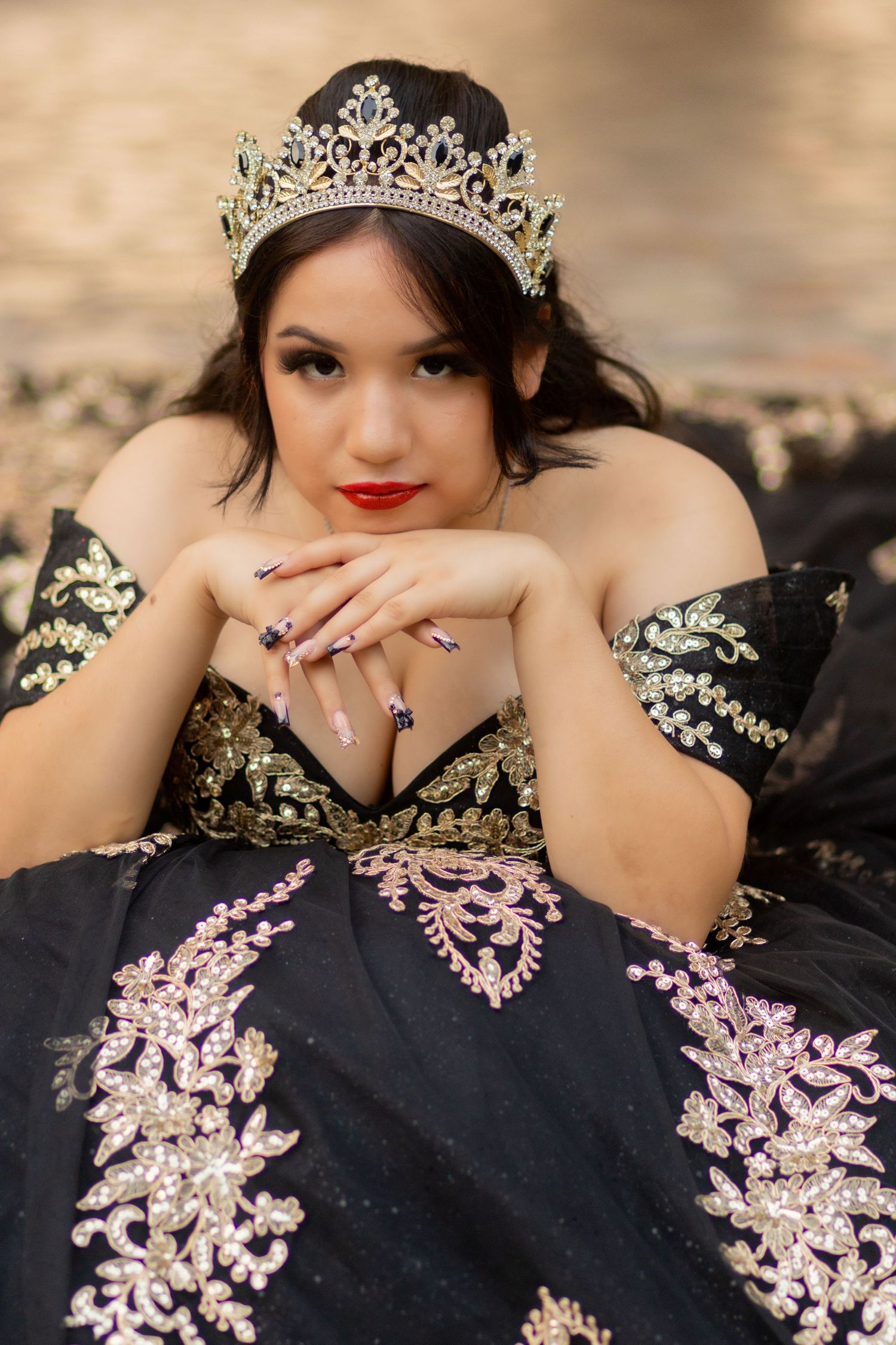 xvenera client takes photos in her black quince dress at Highland Park Texas park