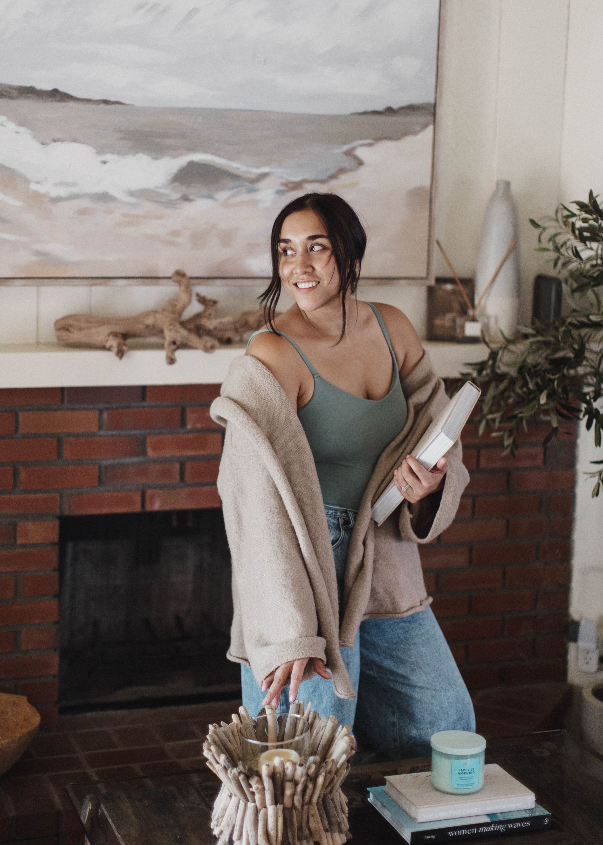 Romantic indoor photoshoot with floral wallpaper and soft natural lighting on a cowhide rug.