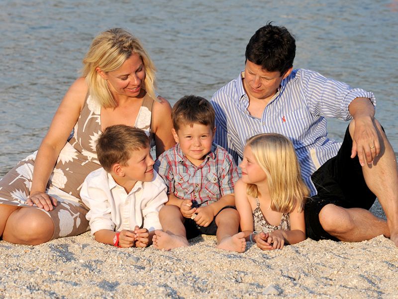 A family enjoying a sunny day at the beach, captured by Abigail's Studio Family Photographer in High Wycombe.
