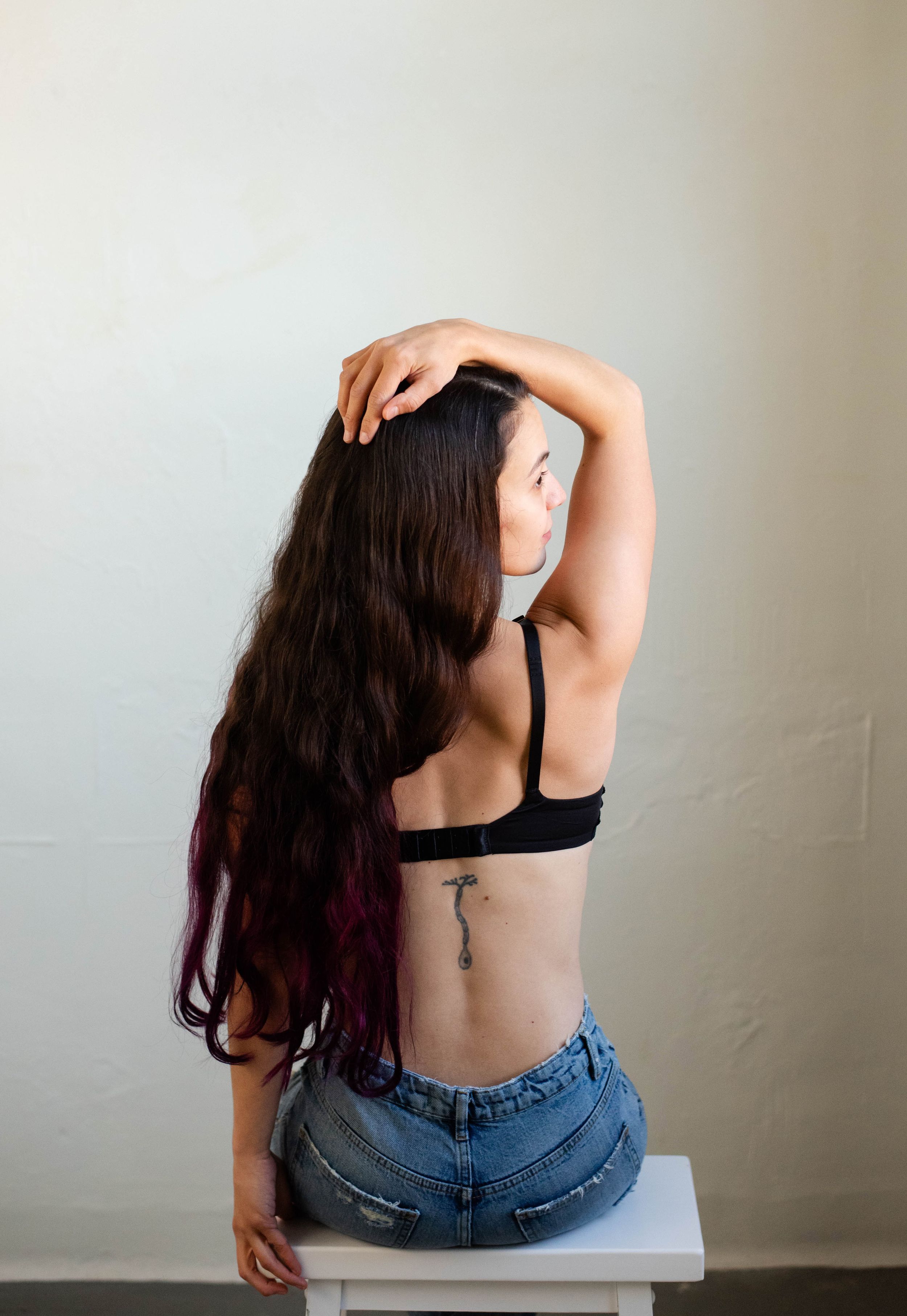 Rochester NY boudoir photography client poses in studio