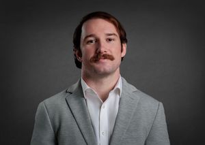 Headshot of young professional in Huntsville, Alabama.