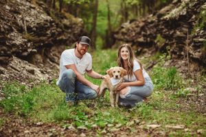 Engagement photos captured in natural wooded setting with rustic charm.