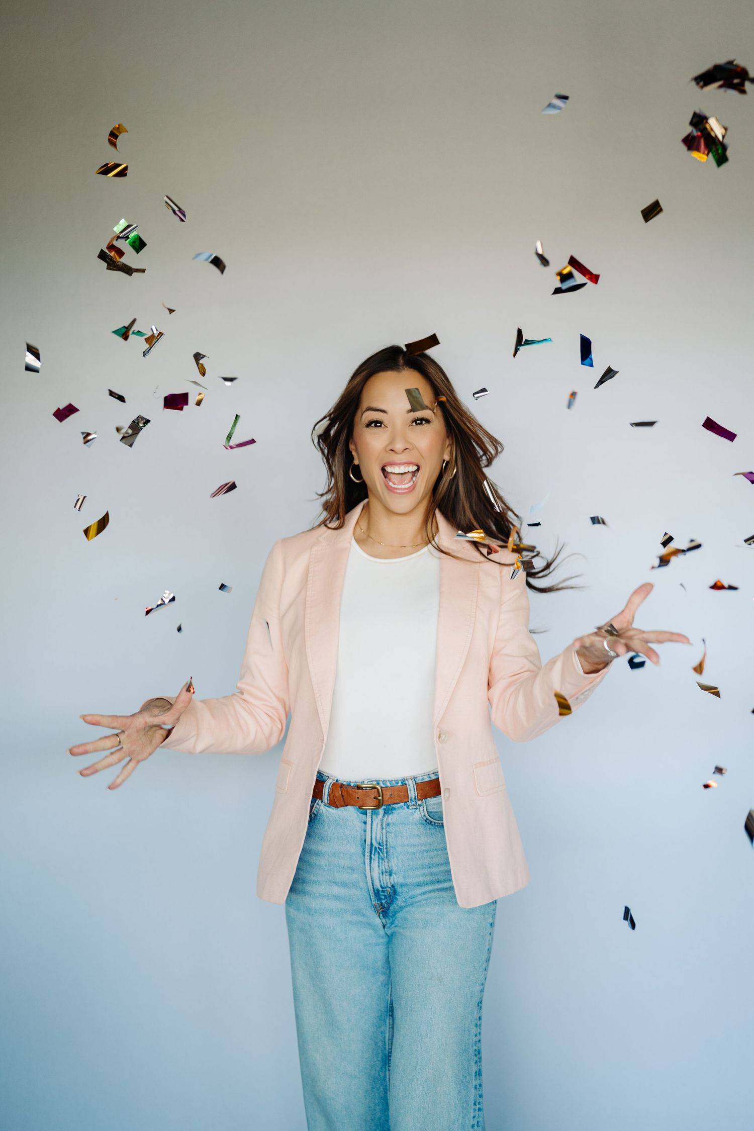 Denver foothills real estate agent celebrating during a branding photoshoot