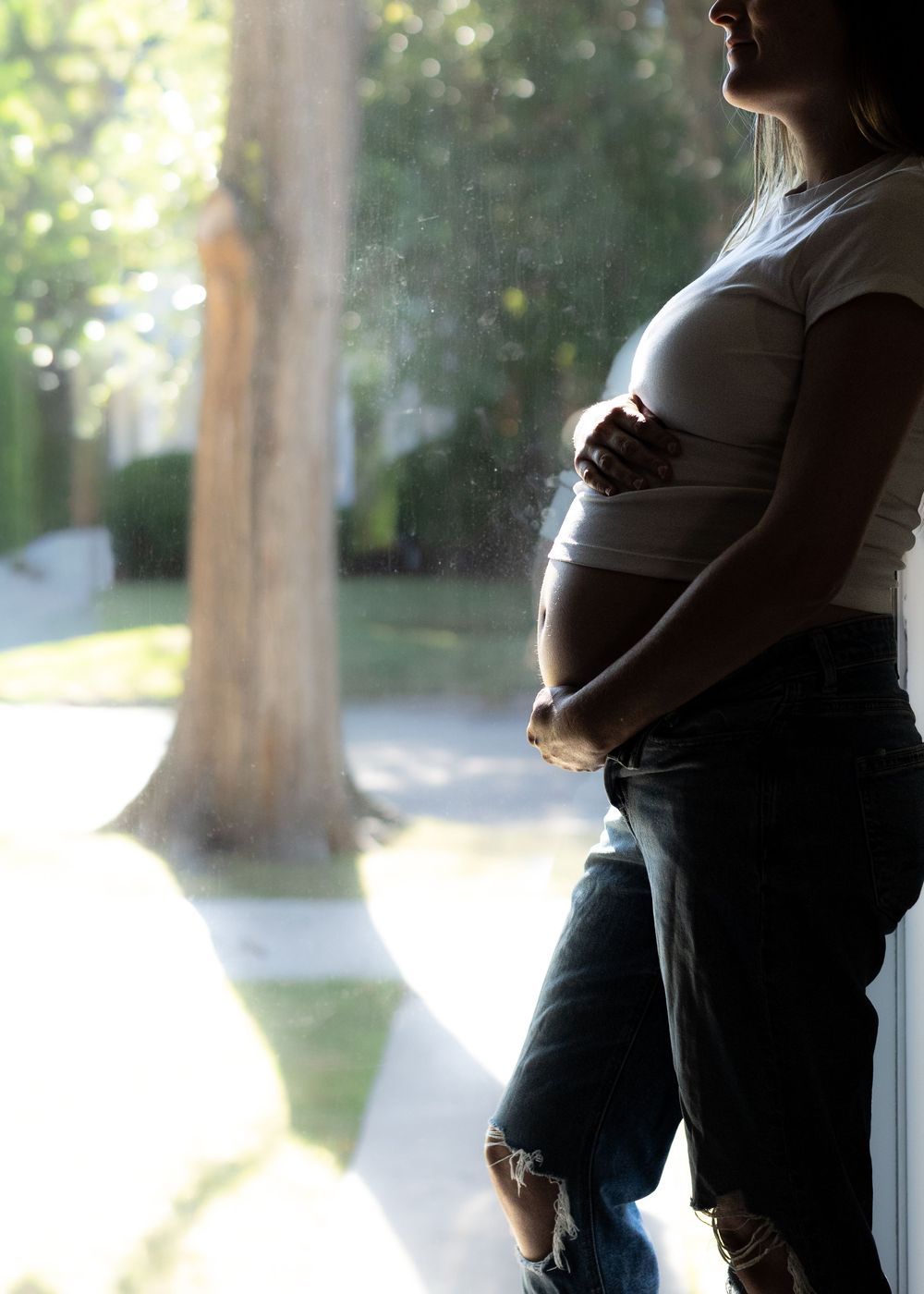 Hannah pregnant belly profile during in-home maternity session in Flint, Michigan