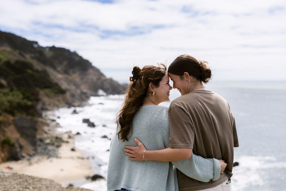 Newly engaged women embracing at Lands End San Francisco