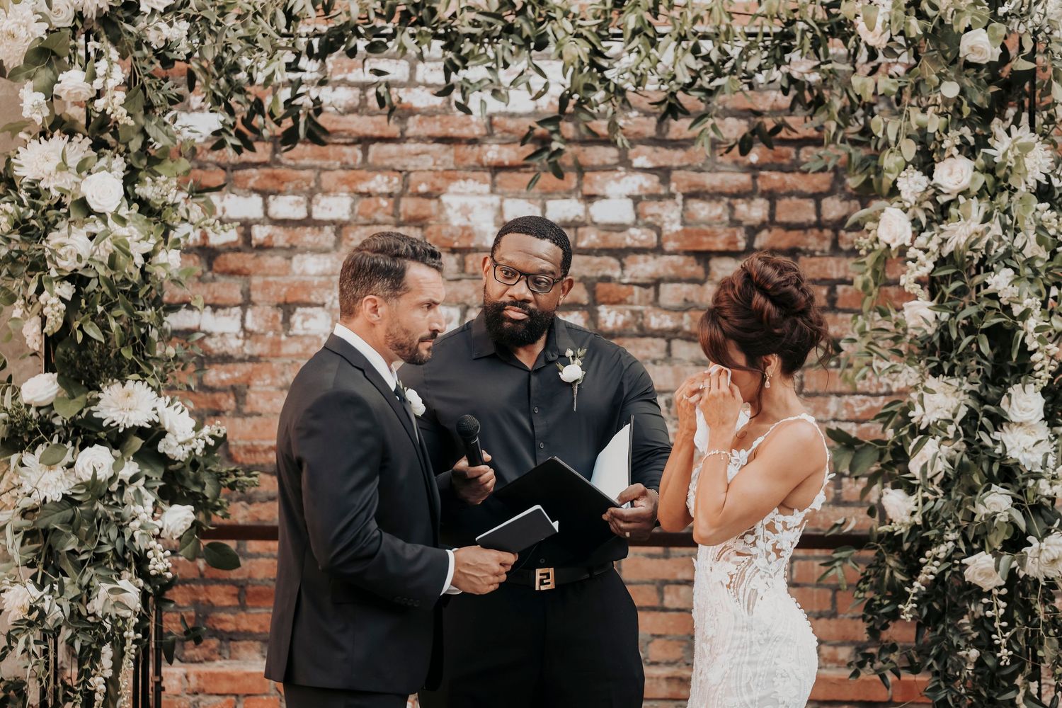 Emotional wedding ceremony moment between Megan and Joel