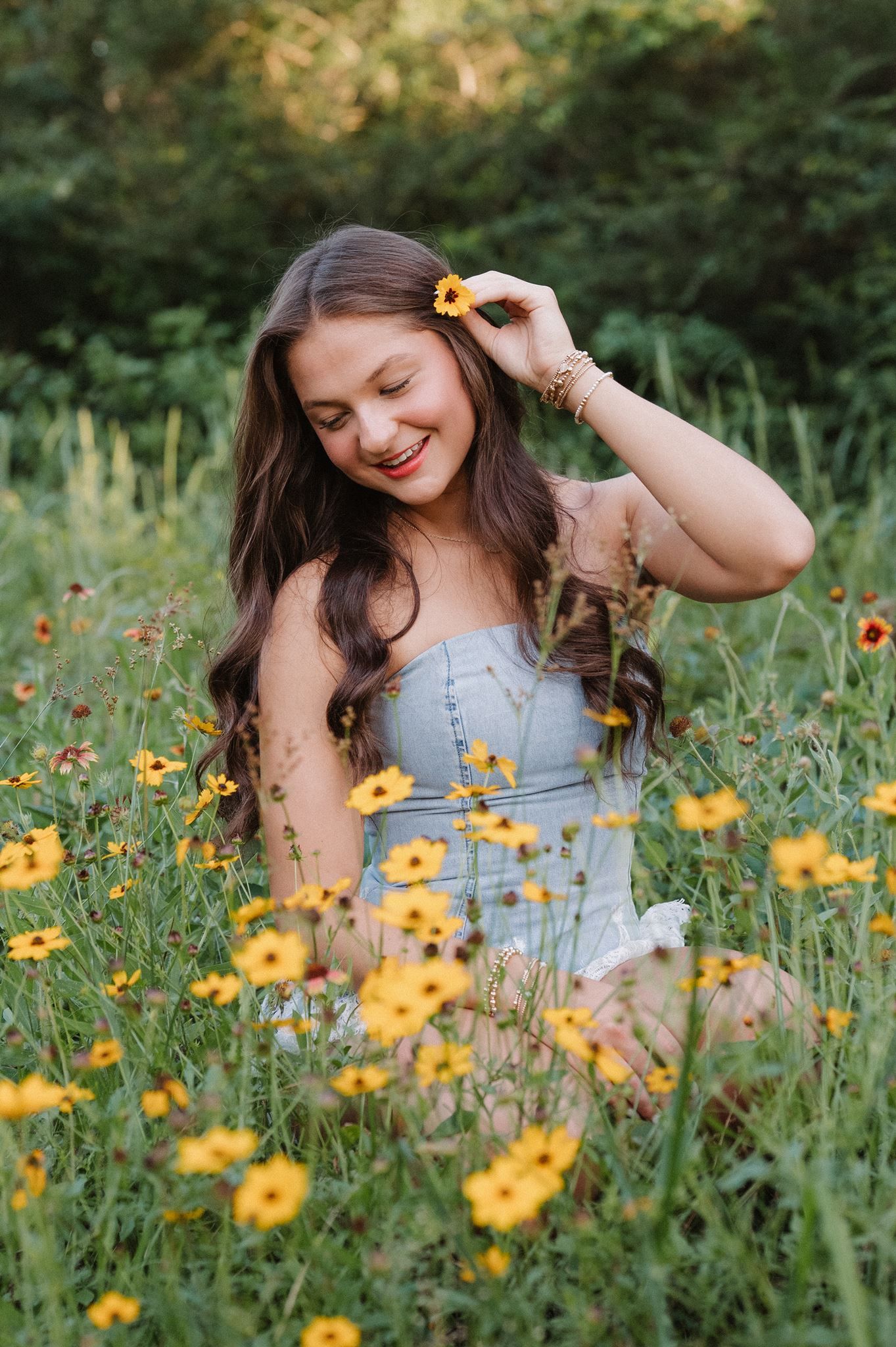 College Park senior girl posing in a meadow in The Woodlands Texas