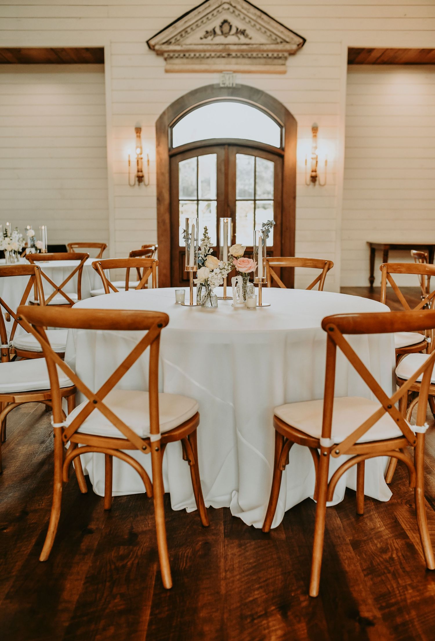 Candlelit wedding tables with blush pink and dusty blue flowers at The French Farmhouse