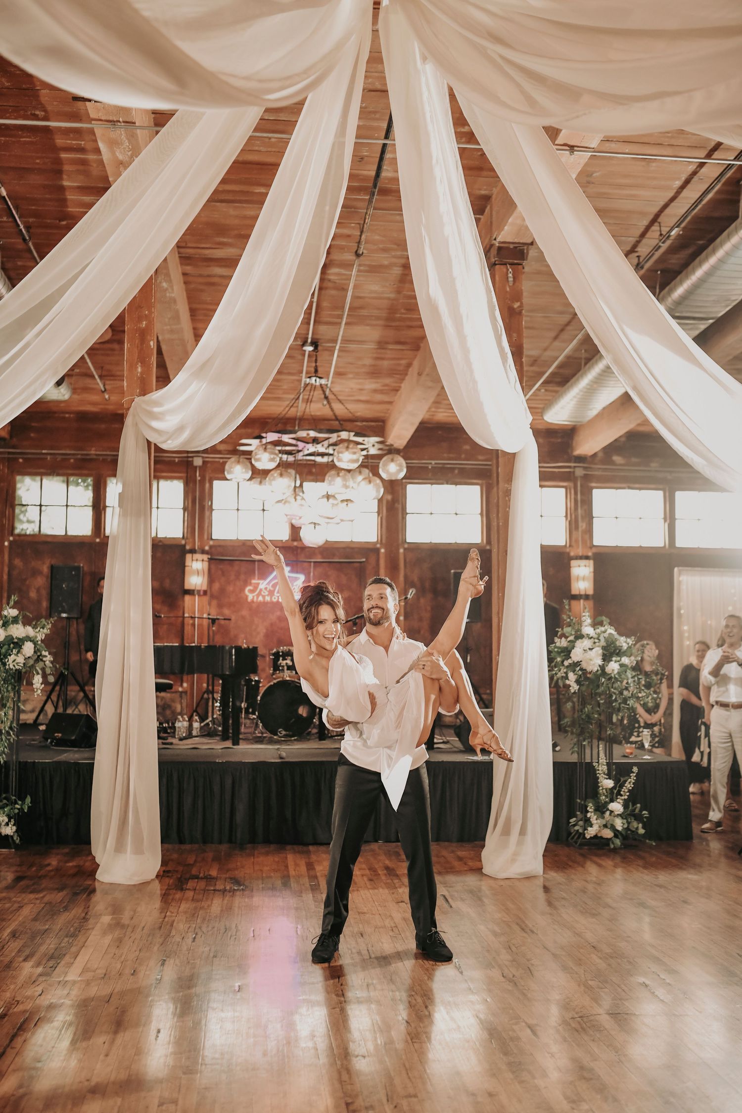 Newlyweds celebrating during their Cotton Mill reception entrance