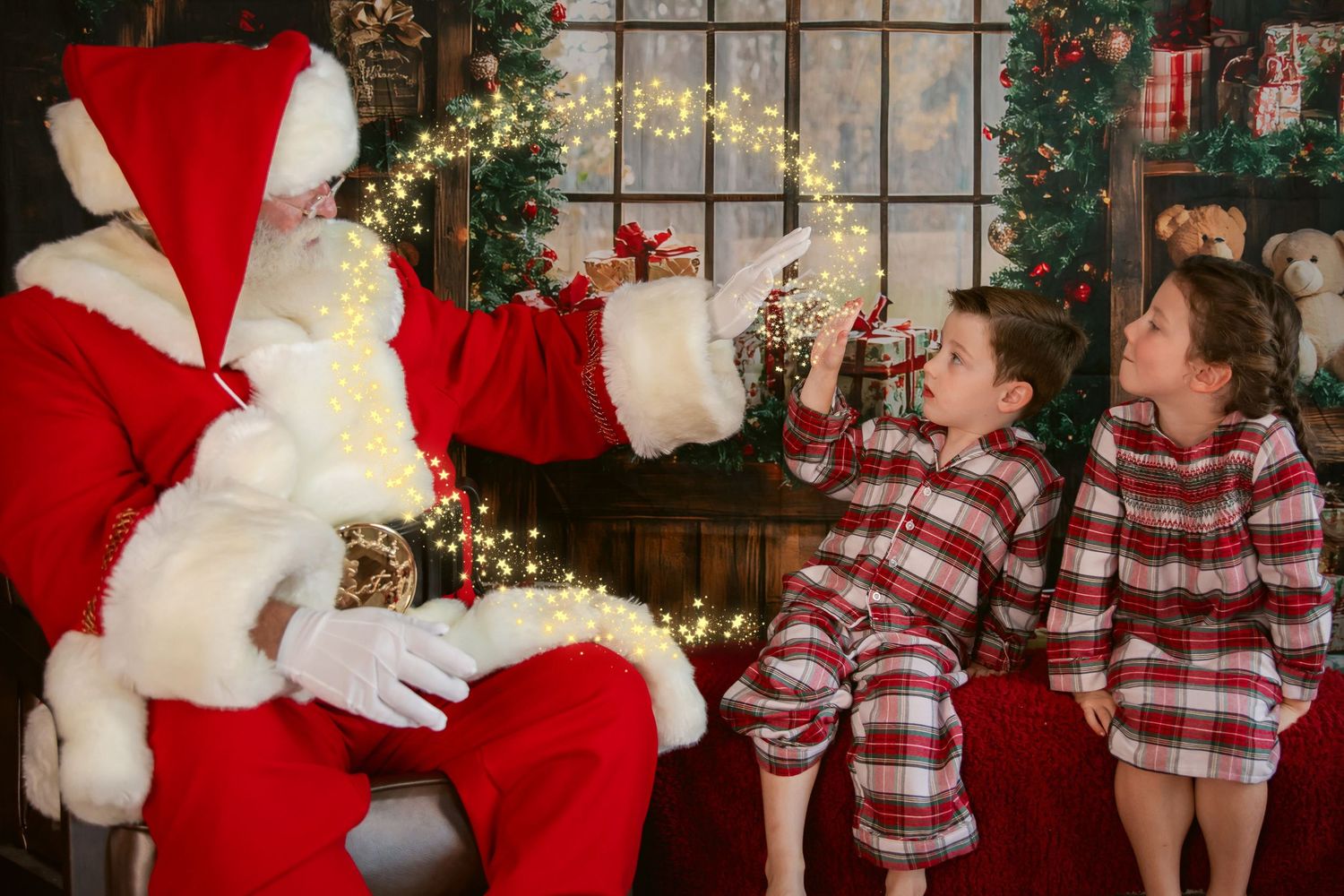 Two children in plaid pajamas meet Santa Claus beside a decorated Christmas tree with warm glowing lights.