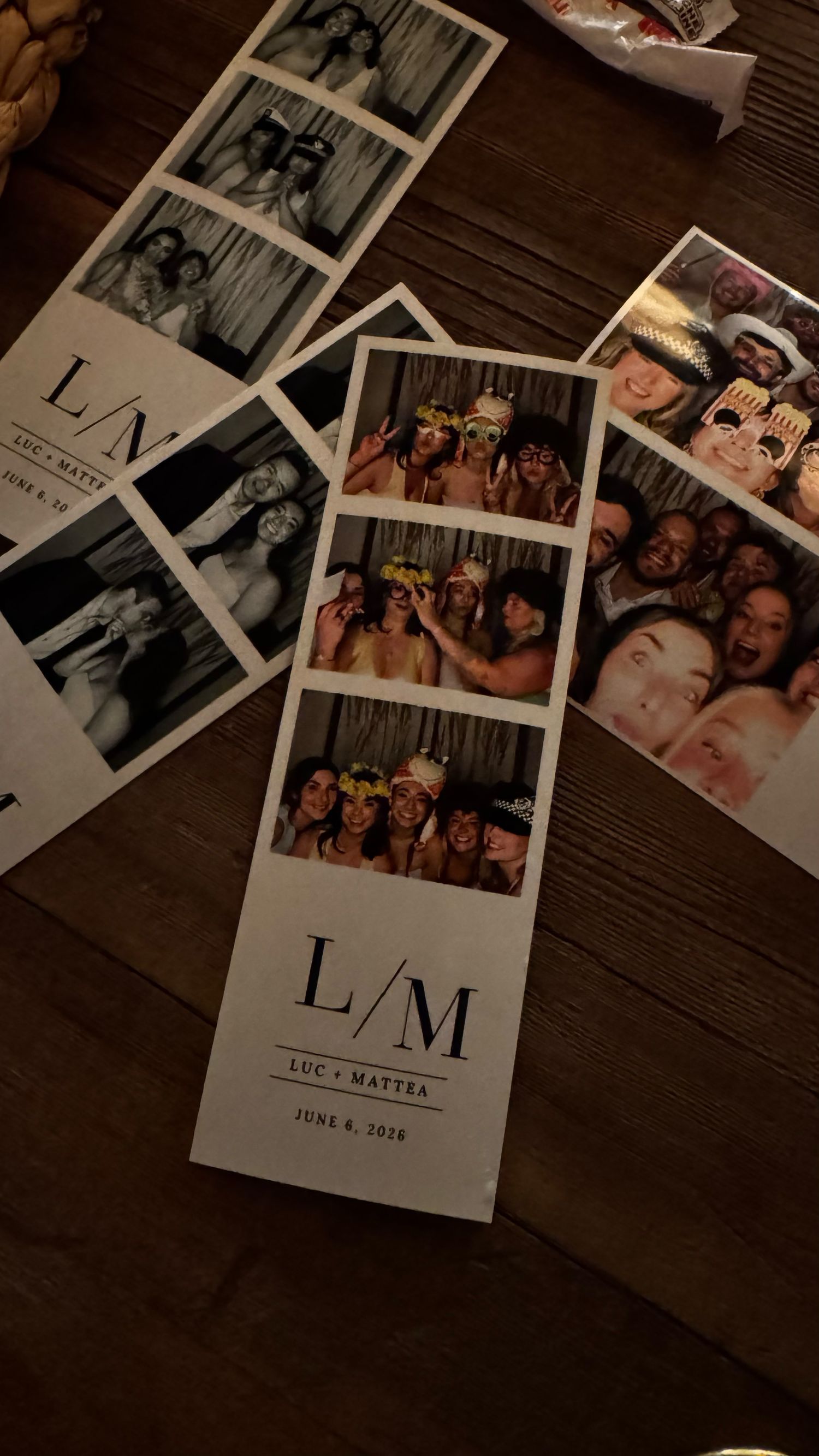 Photo booth strips from Luc and Mattea wedding on June 8, 2026, featuring fun group photos with props on wooden table.