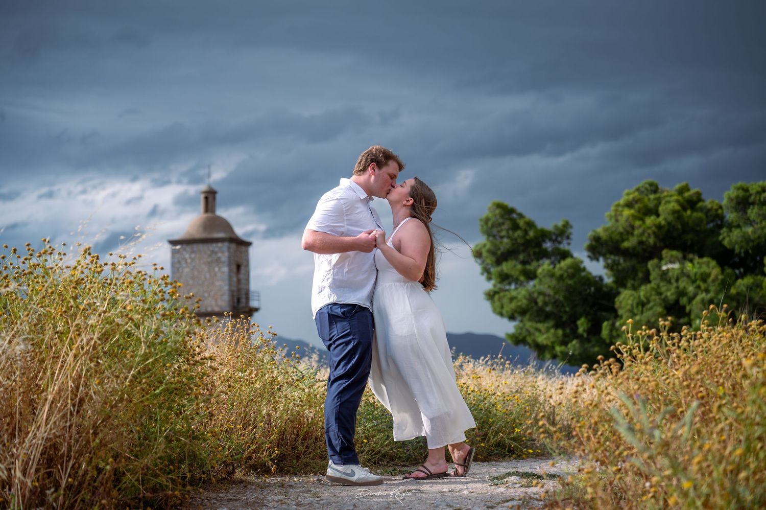 Lovely couple kissing in field of daizys and show love and effection each other for long lasting promisses - proposal
