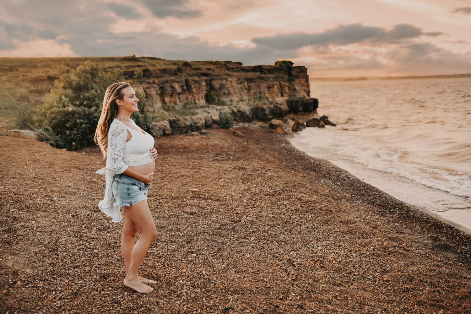 Parents-to-be sharing a quiet moment by the water