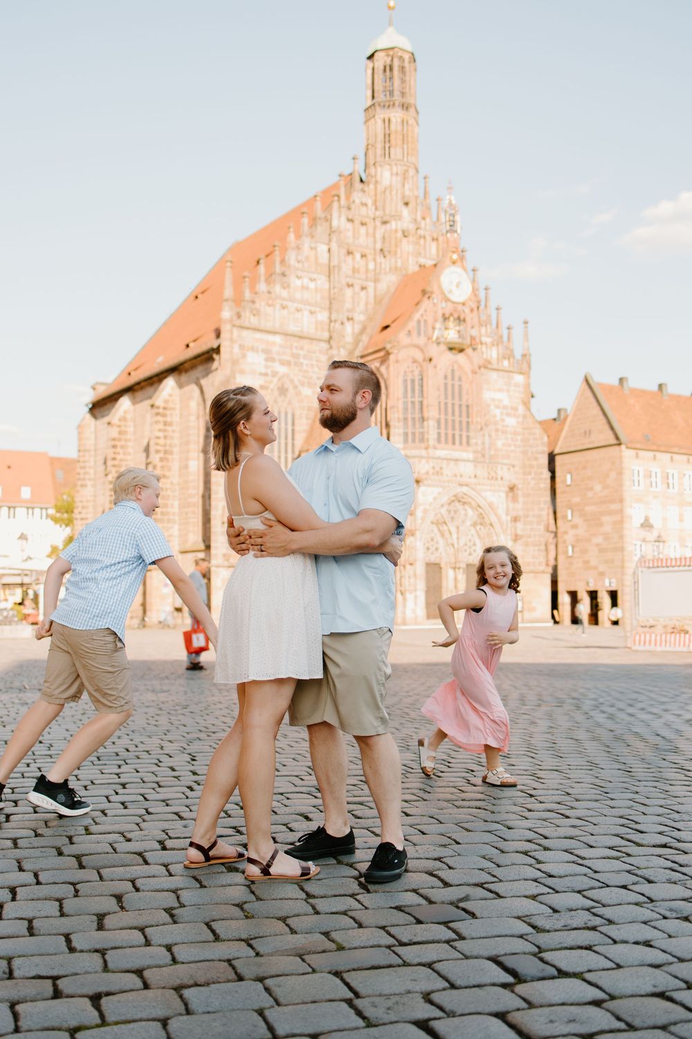 Documentary family photographer capturing moments in the Hauptmarkt in Nuremberg Old Town Germany