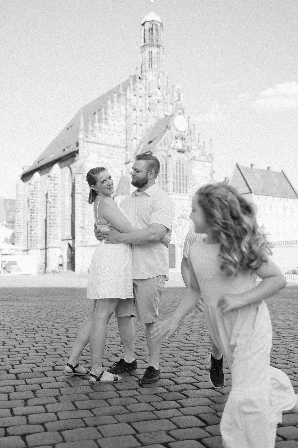 Documentary family photographer capturing moments in the Hauptmarkt in Nuremberg Old Town Germany