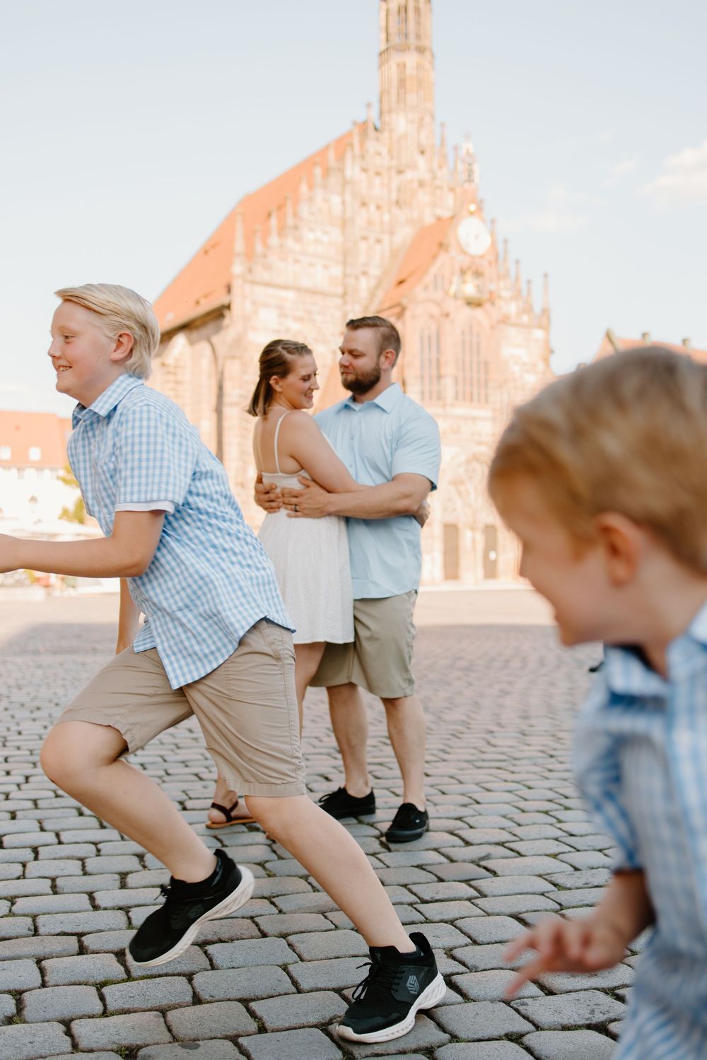Documentary family photographer capturing moments in the Hauptmarkt in Nuremberg Old Town Germany