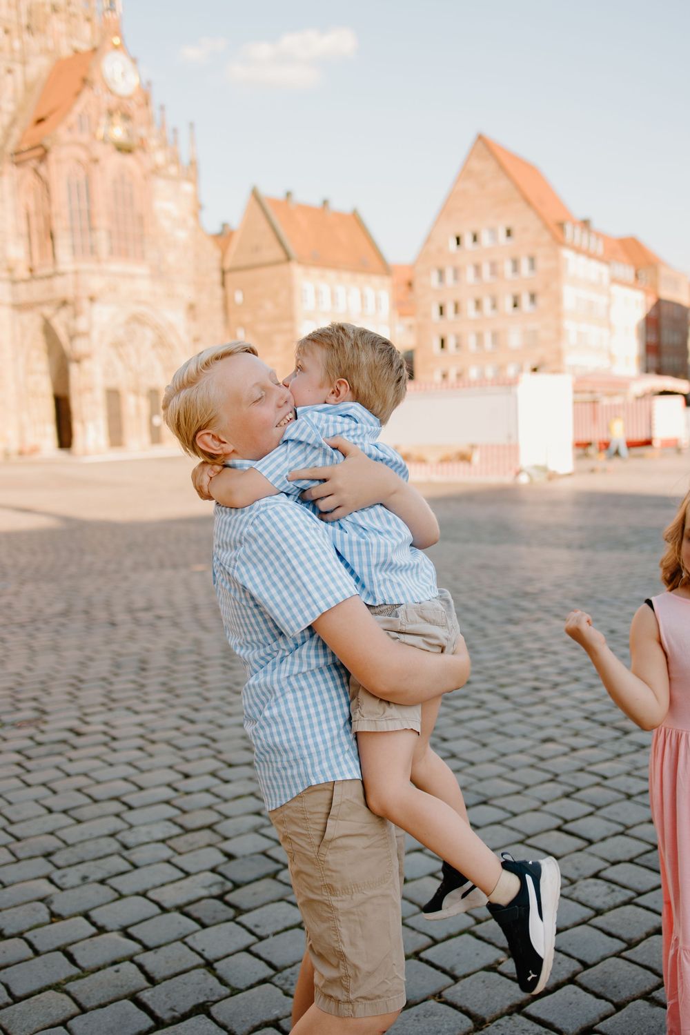 Documentary family photographer capturing moments in the Hauptmarkt in Nuremberg Old Town Germany