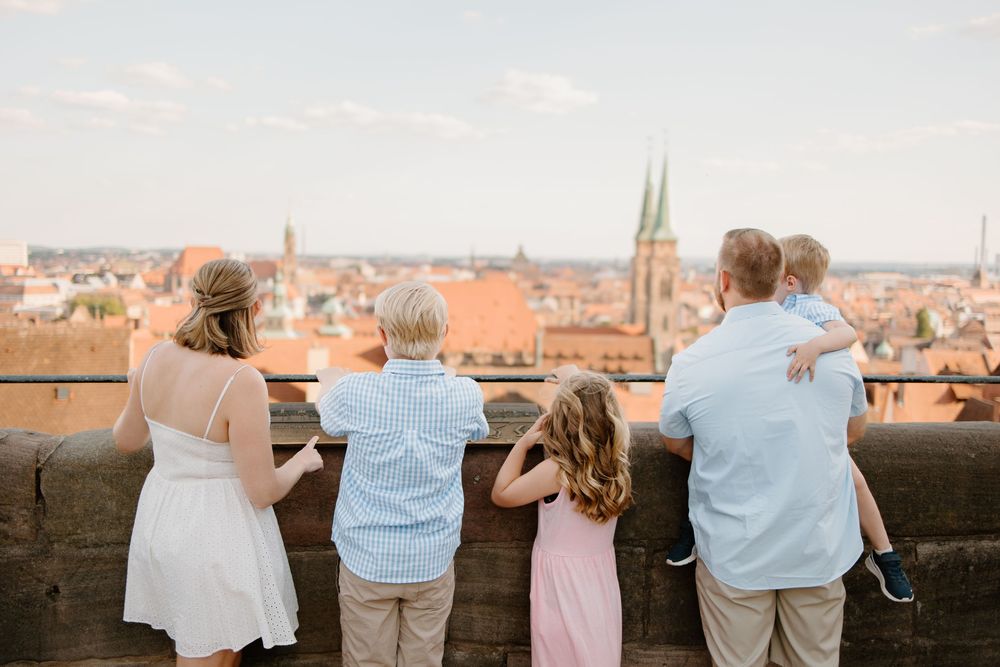 Family photoshoot at the Imperial Castle in Nuremberg, Germany enjoying the panoramic view of Nuremberg