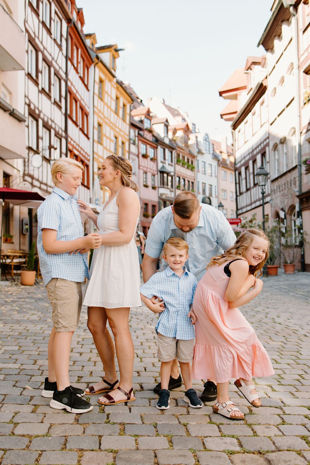 Family walking through Weißgerbergasse during Nuremberg family photoshoot