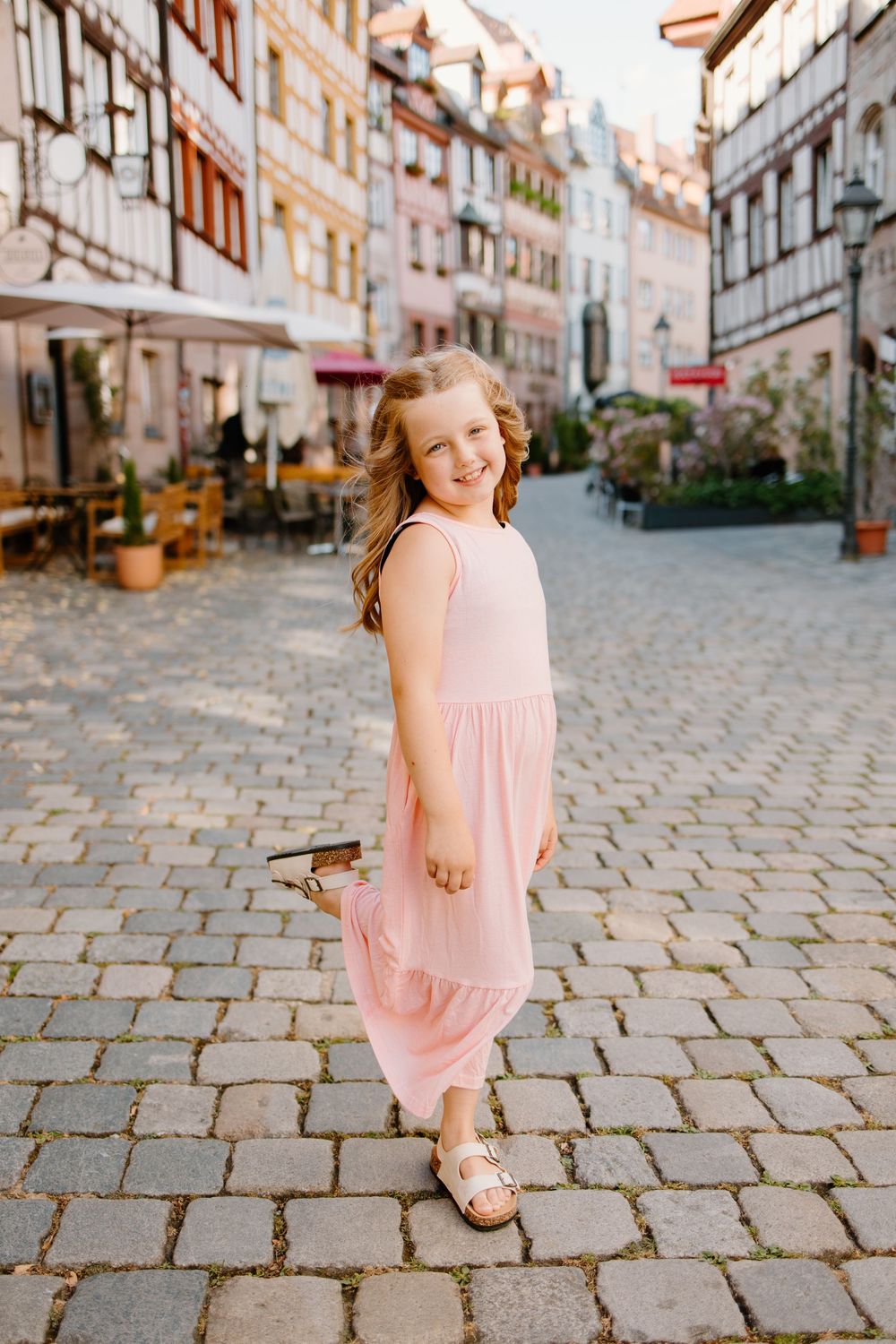 Family walking through Weißgerbergasse during Nuremberg family photoshoot