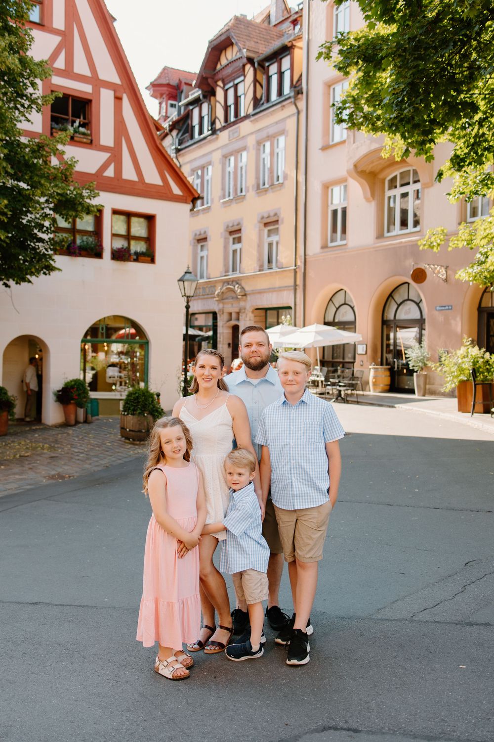 Family walking through Weißgerbergasse during Nuremberg family photoshoot