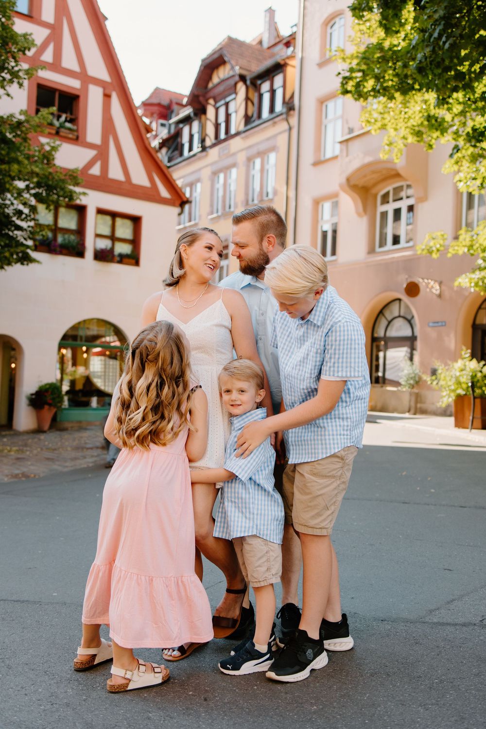 Family walking through Weißgerbergasse during Nuremberg family photoshoot