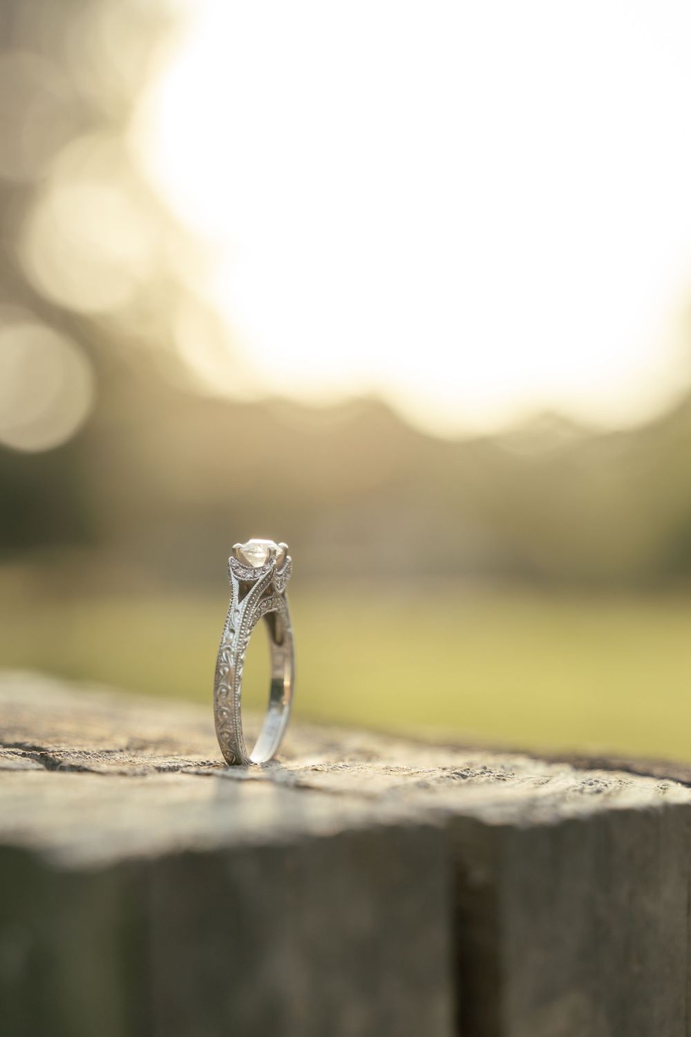 Vintage engagement ring detail photo with rustic vibes with golden hour light