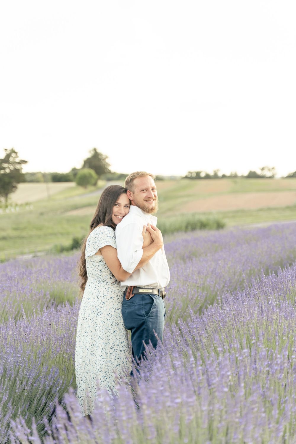 Engagement photo of a couple embraced in a lavender field