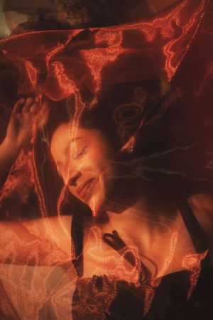Experimental cinematic portrait of a woman with red lighting and intentional motion blur
