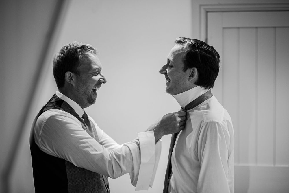 Groom and his best man getting ready for the wedding ceremony