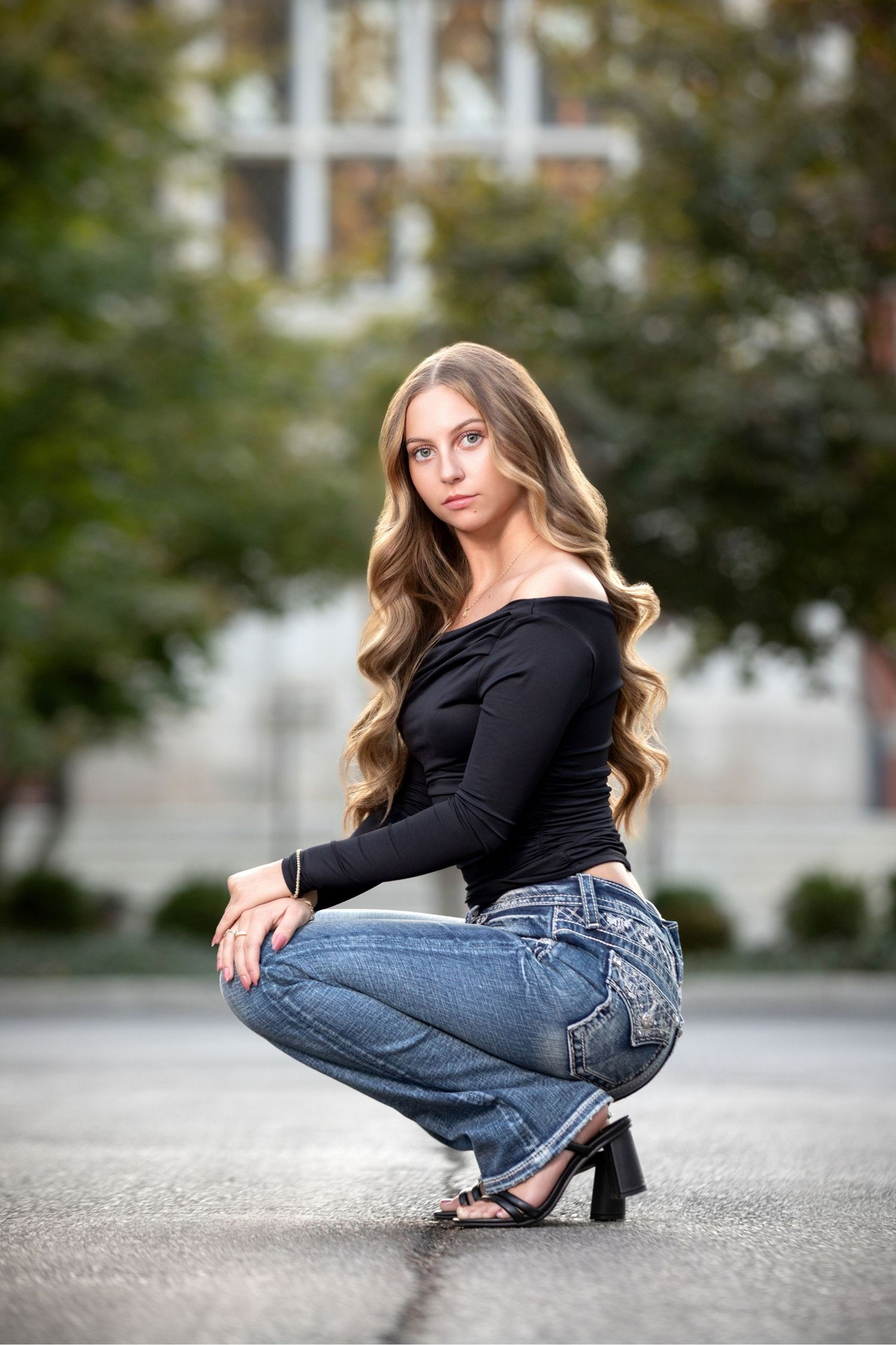 Pickerington Central senior portraits at Jeffrey Mansion in Bexley with stone walls, greenery, and a stylish urban-inspired look.