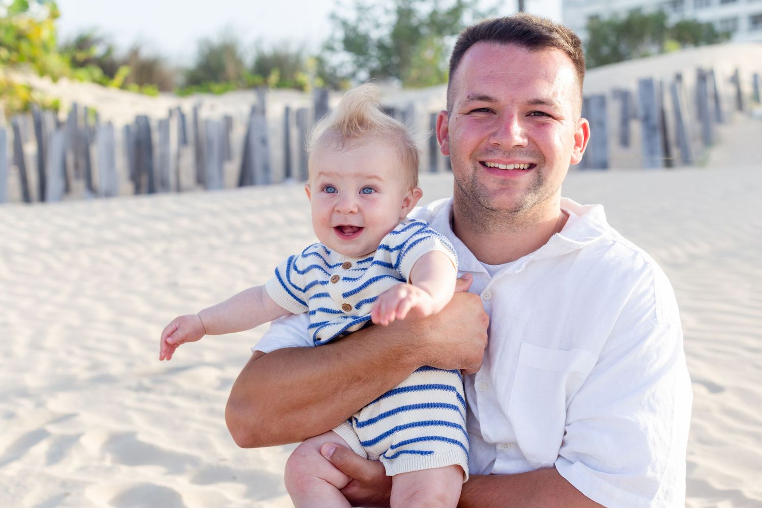 Family portrait on the beach in Isla Verde, Carolina, Puerto Rico. Father and baby.