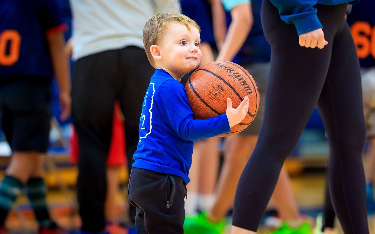 Young player holding the ball at a Hershey youth basketball game, HYBA, by Deanna Fox, SportsFox Photography based in Hershey PA