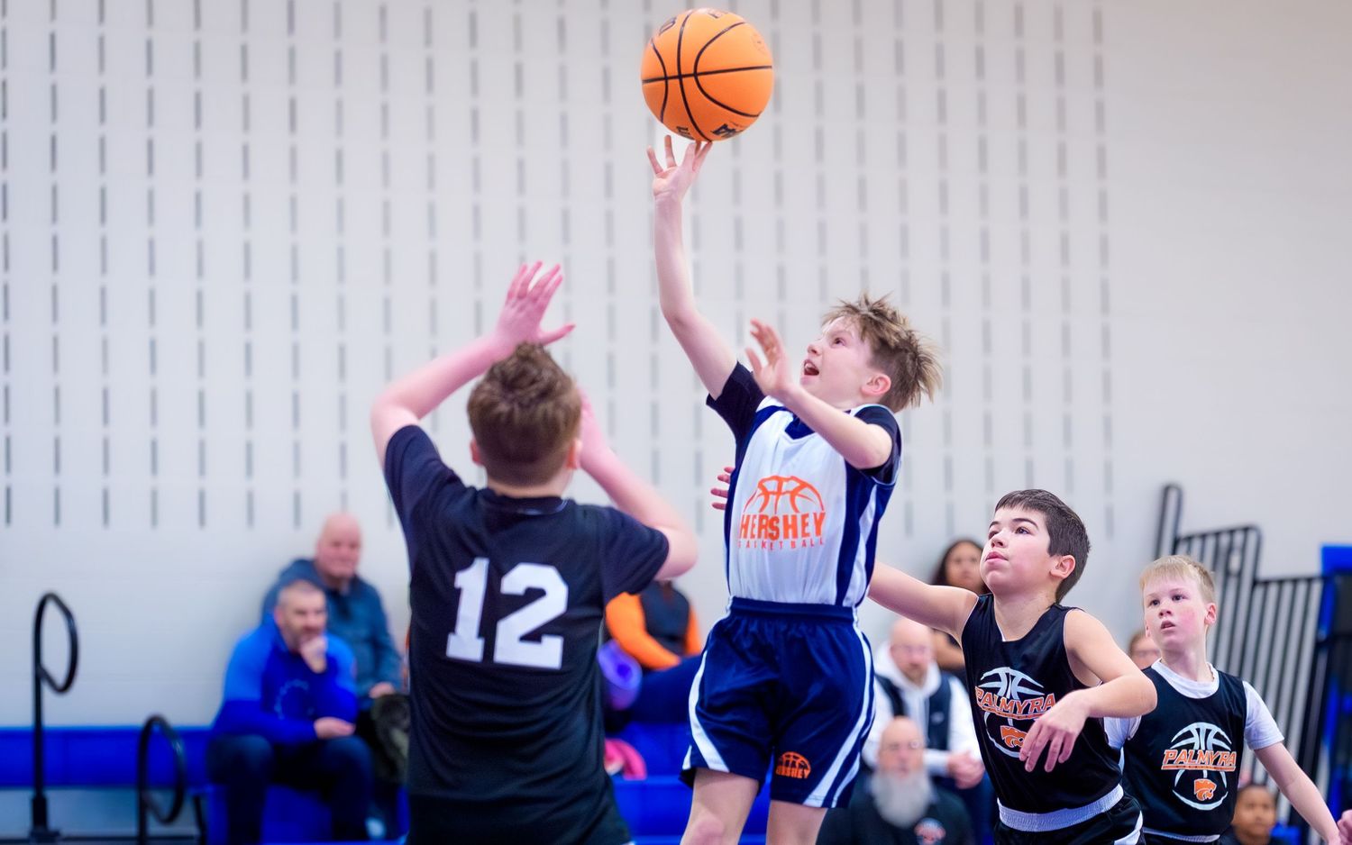 Hershey 4th-grade boys player shooting over a defender, Chocolatetown Tournament, by Deanna Fox, SportsFox Photography based in Hershey PA