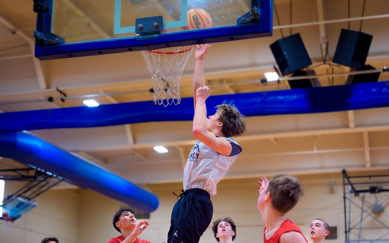 Hershey 8th-grade boys player going up for a layup, Chocolatetown Tournament, by Deanna Fox, SportsFox Photography based in Hershey PA