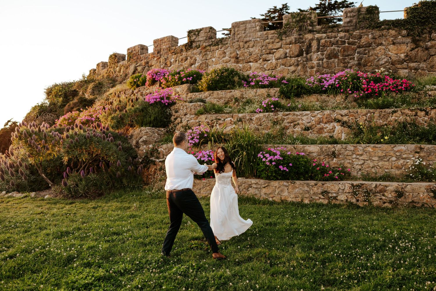 engagement couple candidly running around at vista del mar at sutro heights in san francisco. bay area elopement photographer