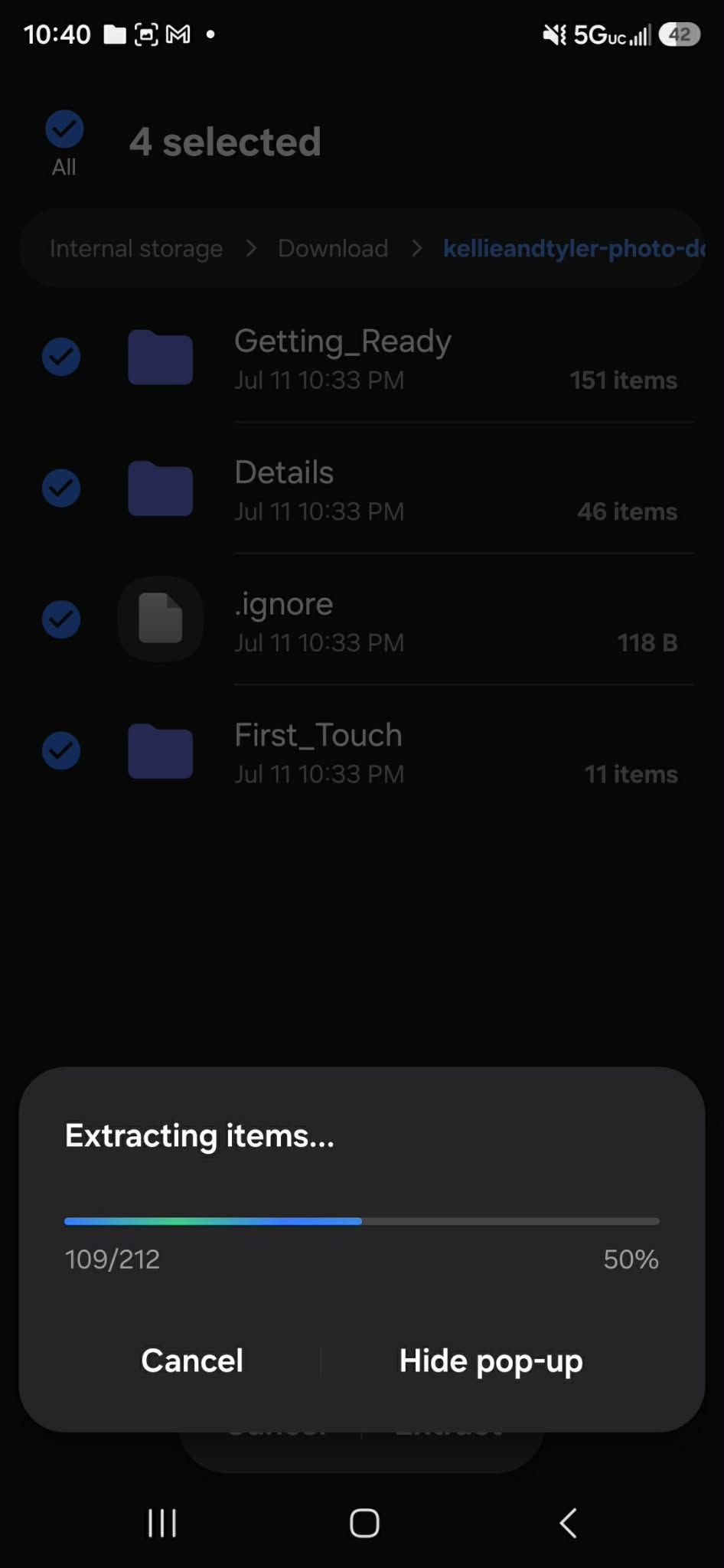 Android file manager extracting 212 items at 50% progress from a wedding photo download folder.