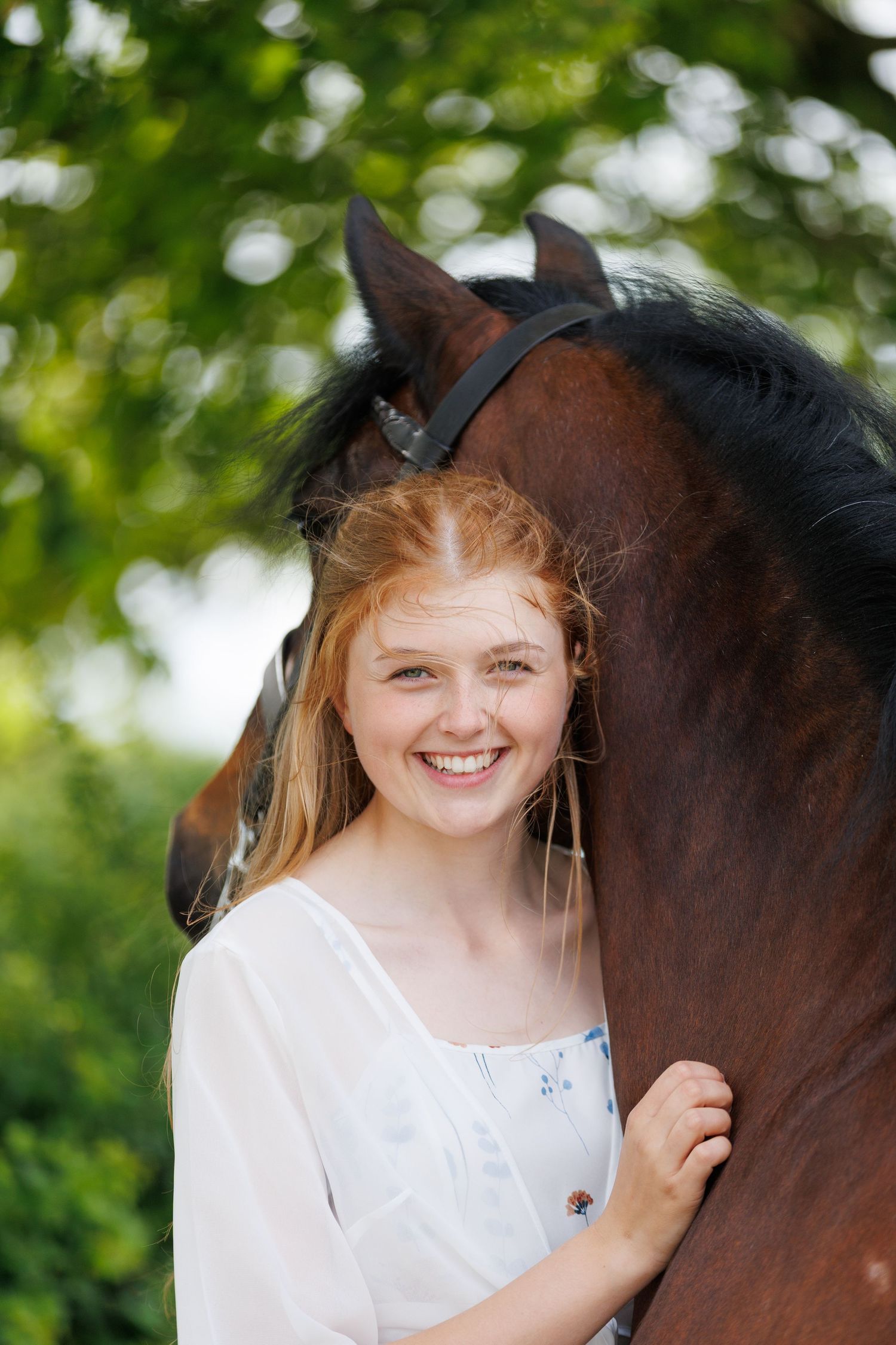 A series of photos showing a person in a white polka dot shirt with a black horse in a golden autumn field.