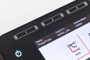 Product shot | Close-up of a Cadonix controller screen showing station pairing status, active connection, and build interface controls.