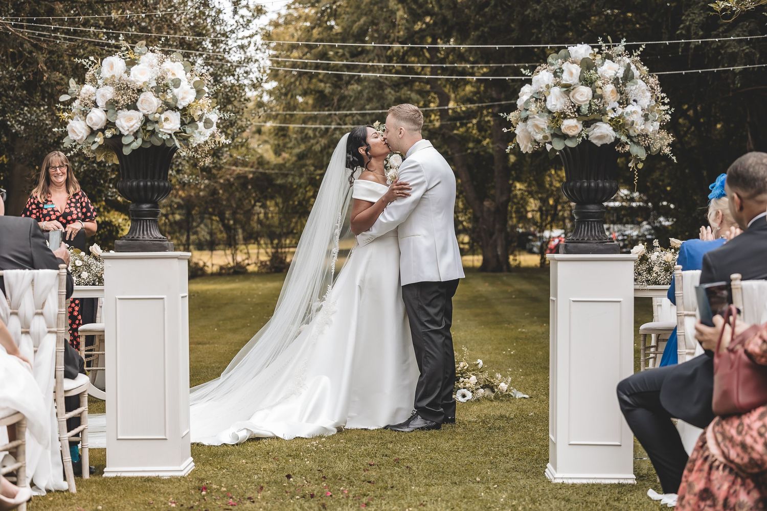 Natural outdoor wedding ceremony in the grounds of Bardney Hall