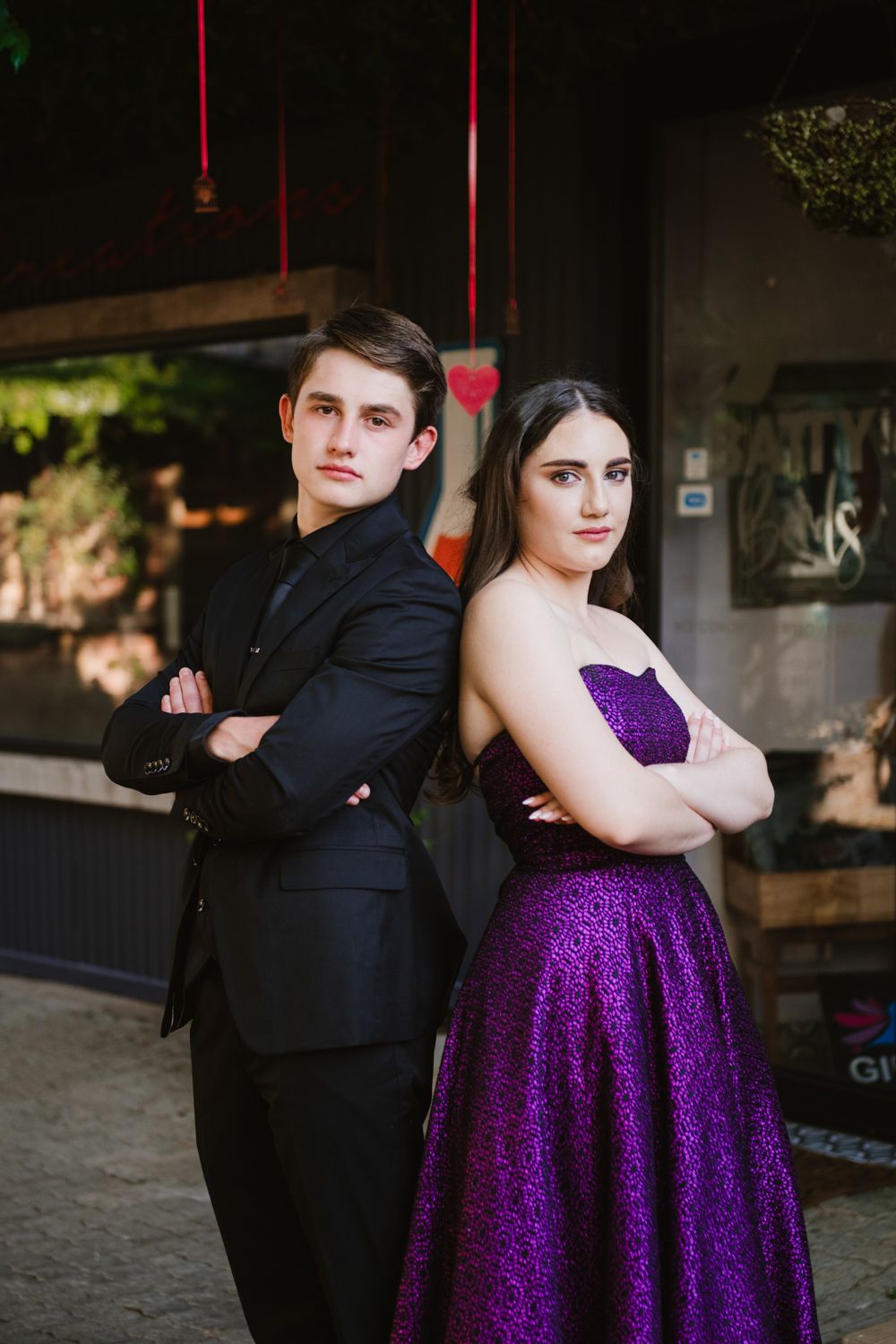 Dramatic portrait of a matric couple posing together in formal evening wear.