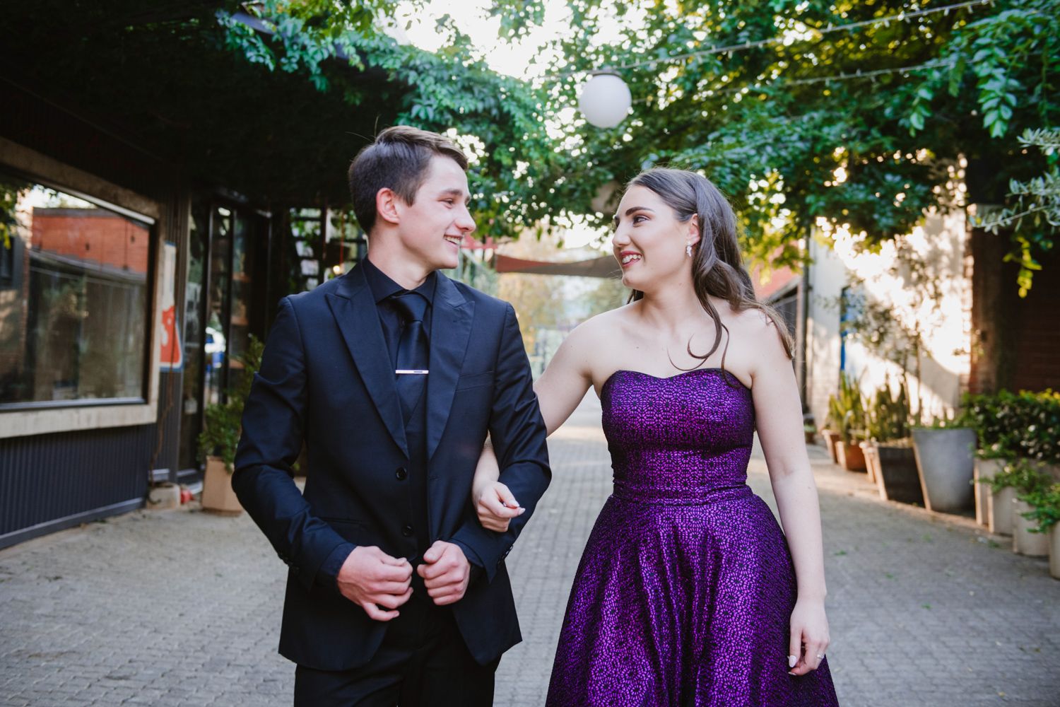 Dramatic portrait of a matric couple posing together in formal evening wear.