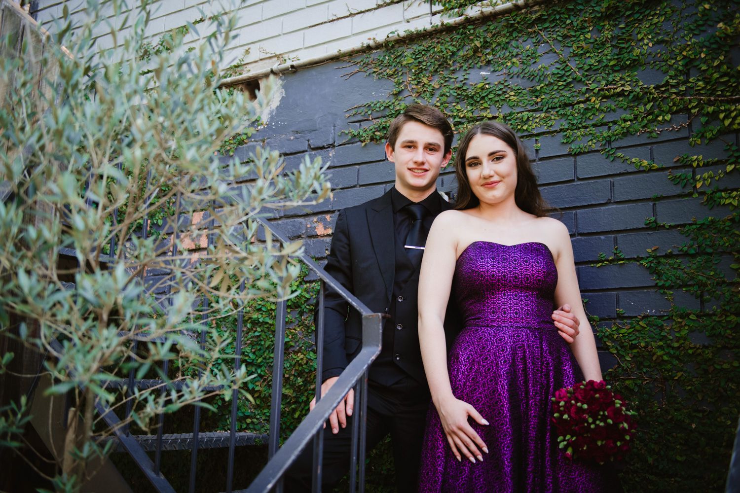 Close-up of a matric couple looking at the camera during their farewell photoshoot.