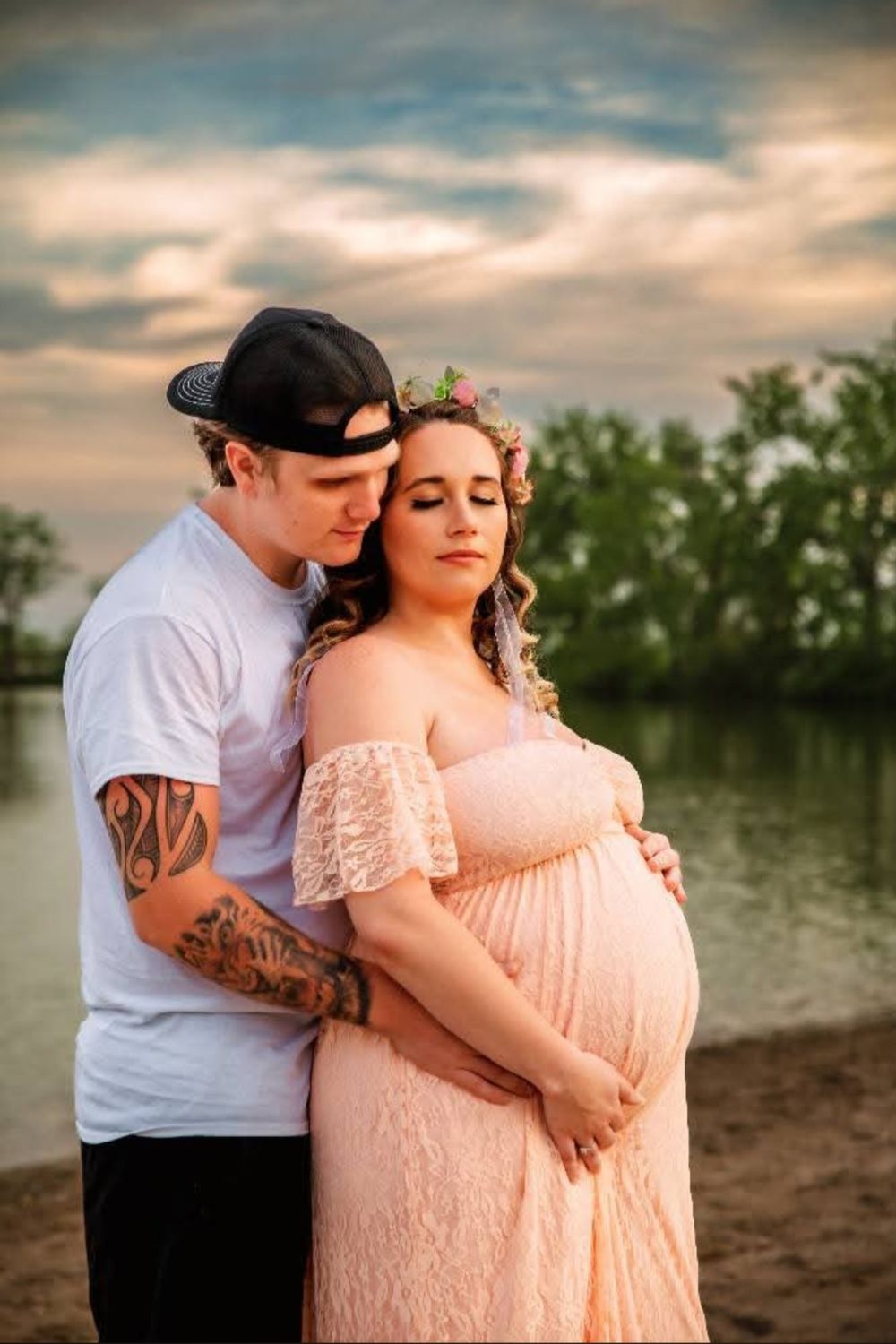 Expecting mother and father during an outdoor maternity photography session in St. Marys, Ohio