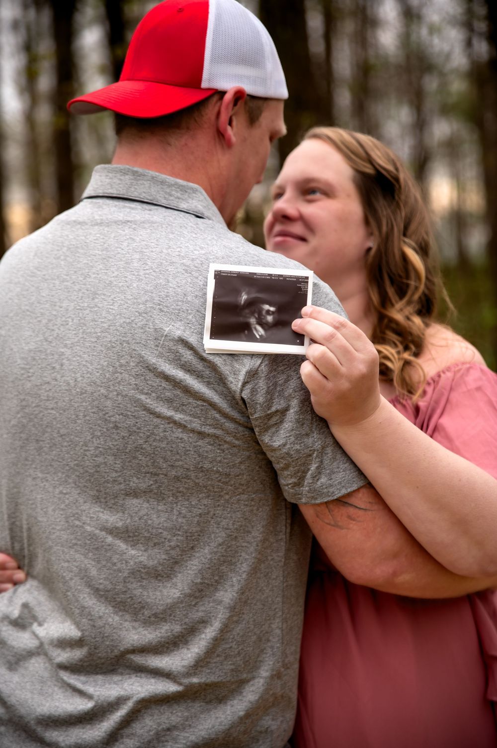 Expectant couple embracing during a maternity photography session in St. Marys, Ohio