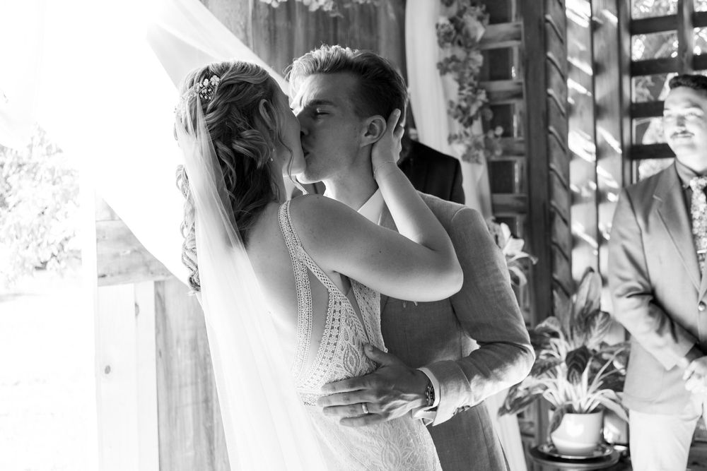 Bride and Grooms first kiss in B&W