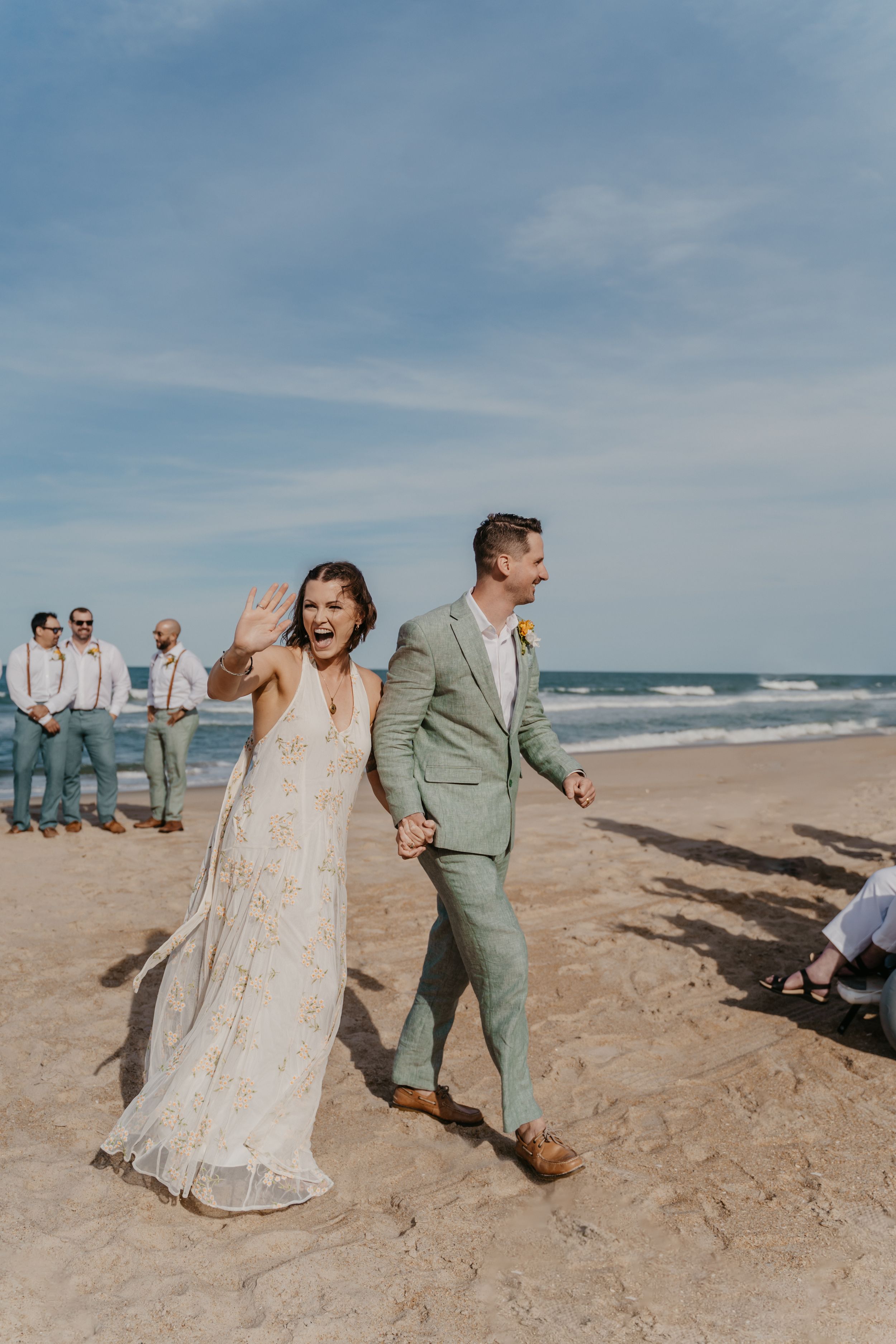 wedding couple posing on a beach in north carolina