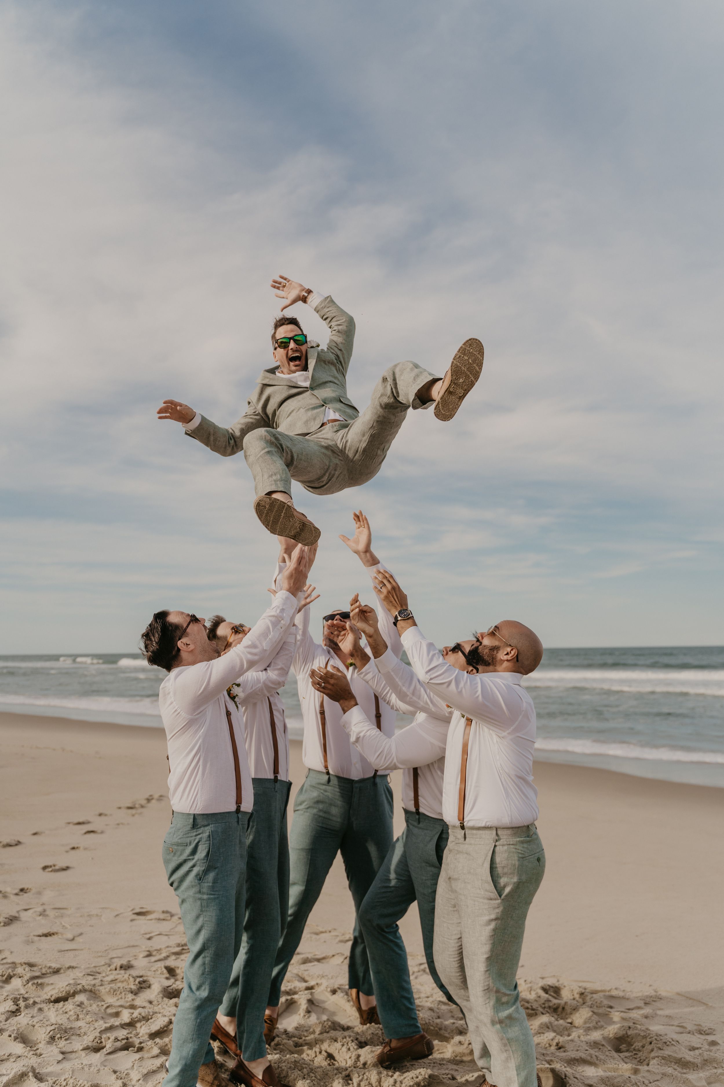 wedding couple posing on a beach in north carolina