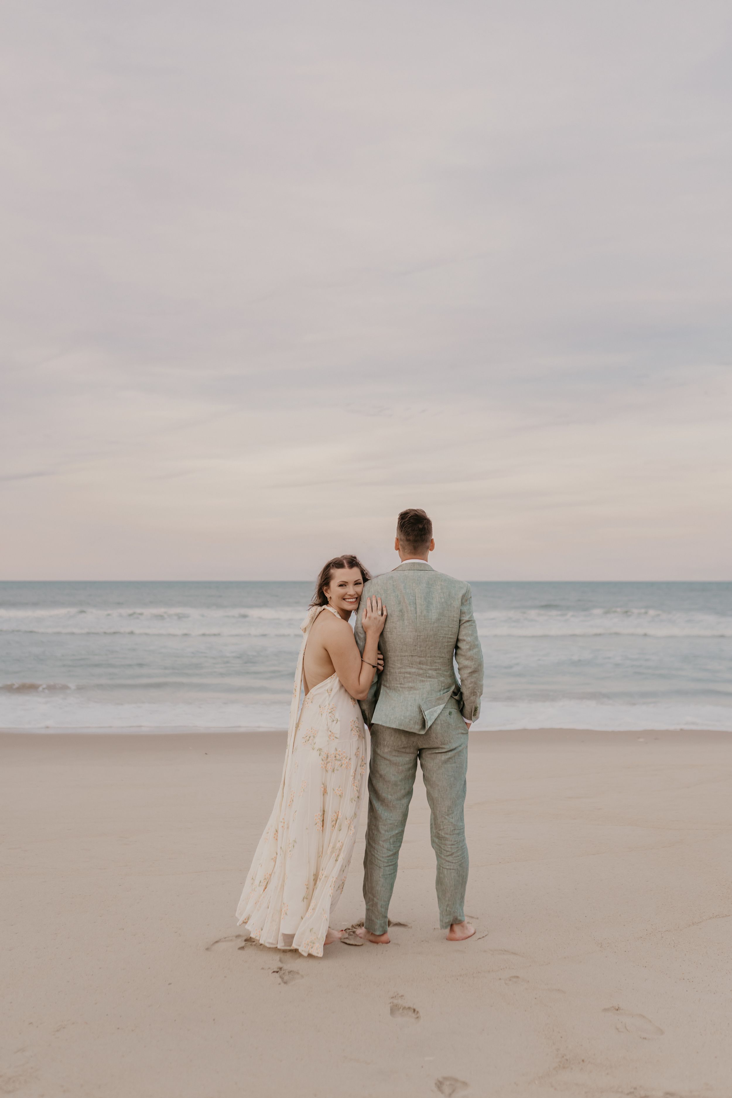 wedding couple posing on a beach in north carolina